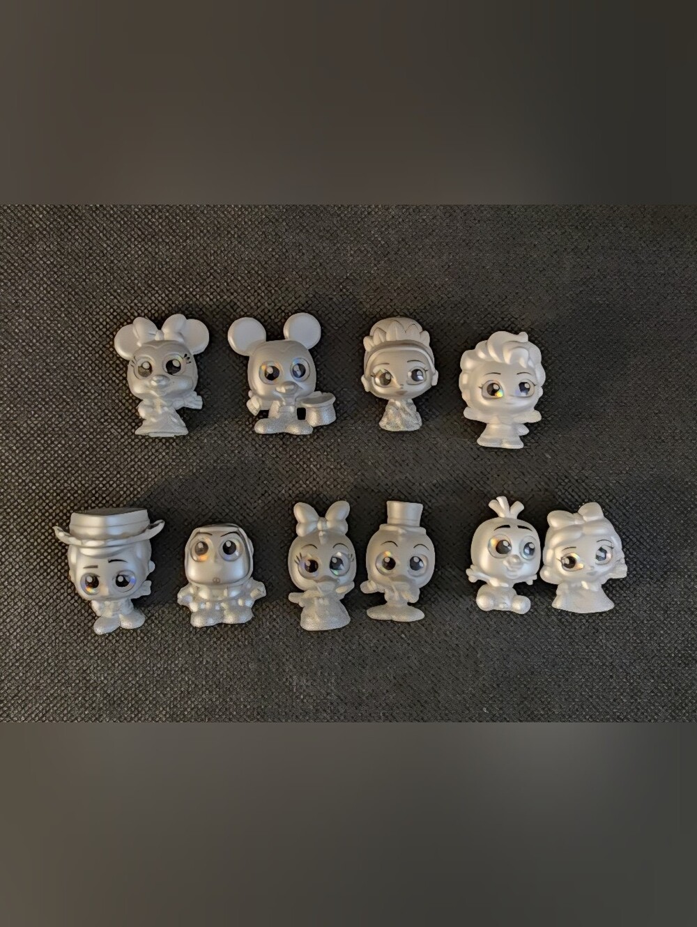 Disney Doorables 100 Year Silver Platinum Figures.